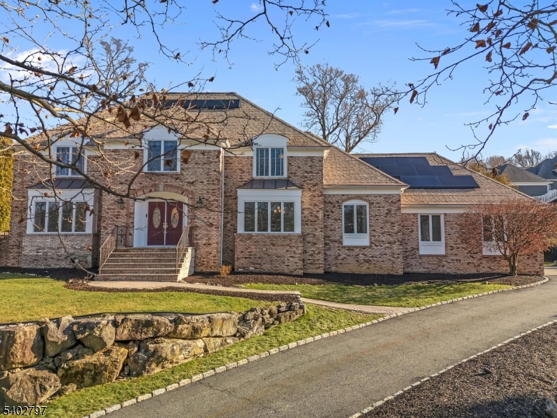 This exceptional 5BR/3BA residence in the sought-after Summit neighborhood of Morris Township blends thoughtful updates, modern infrastructure and a true indoor-outdoor lifestyle.At its centerpiece is a stunning heated saltwater pool (2022), set within a fully fenced, private backyard with expansive patio areas, swing-set space, and storage shed ideal for entertaining or everyday enjoyment.Designed for comfort and efficiency, the home features a 2025 solar energy system with two Powerwall backup batteries, providing energy independence for up to three days.The kitchen, fully remodeled in Summer 2025, showcases high-end appliances, refined finishes, and excellent functionality, flowing seamlessly into bright, open living spaces filled with abundant natural light.The primary suite offers exceptional storage with two walk-in closets.Four additional bedrooms provide flexibility for guests, home office, or growing needs. A partially finished basement offers a versatile recreation space with pool, foosball, and ping-pong tables. Additional benefits include exterior surveillance cameras and an EV charger.Ideally located just minutes from downtown Morristown, enjoy acclaimed dining, shopping, arts and medical centers along with major corporate employers.Experience the charm of Morristown's Revolutionary War heritage paired with a vibrant, modern town center and year-round community events.Outstanding commuter access via NJ Trans Midtown Direct to NYC.