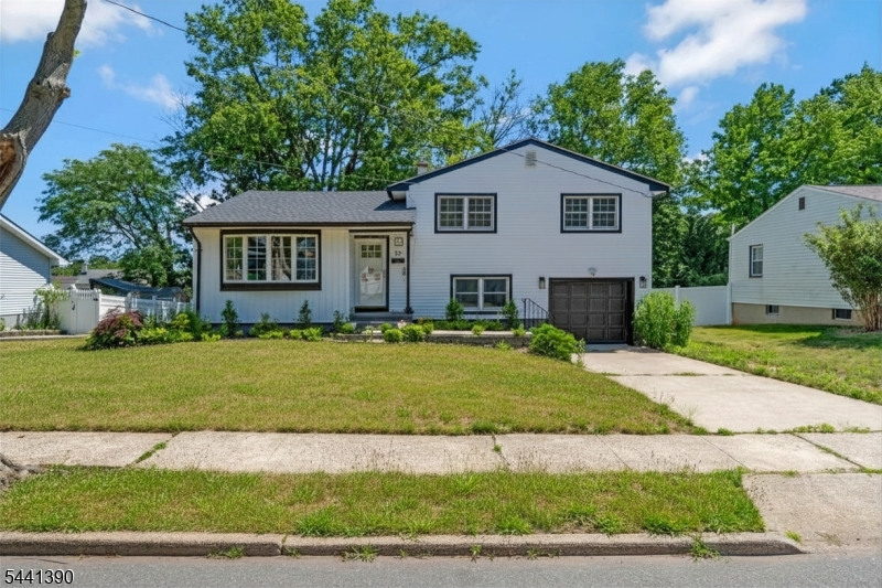 Fully renovated in 2025, this spacious 4-bedroom, 3-bath split-level home combines modern updates, flexible living space, and a prime Edison location. The ground level features a bedroom and full bath, ideal for guests or a home office. Step inside to find tall ceilings, crown molding, and an open, airy layout. The updated kitchen is the heart of the home, featuring quartz countertops, a large center island, stainless steel appliances, and ample space for cooking and entertaining. The living and dining rooms flow seamlessly, offering both comfort and functionality. Upstairs, the primary suite includes a private full bath, while the additional bedrooms provide generous space and natural light. Outside, enjoy a fenced backyard with plenty of room for entertaining, pets, or relaxing. Additional highlights include a roof that's only 5 years old and move-in-ready condition with all major renovation work already completed. Located in the highly desirable South Edison school district, this home offers convenient access to Route 1, Route 287, the NJ Turnpike, Garden State Parkway, and two NJ Transit train stations, making commuting throughout New Jersey and New York simple and convenient.