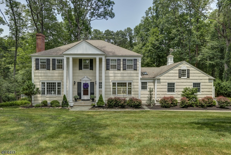 Stunning, updated colonial in desirable Rolling Hill section offers 5 bedrooms, 2 1/2 baths, hardwood floors throughout, updated kitchen, master suite and walkout basement to private, wooded backyard. You can move right into this gorgeously updated, perfectly situated and amply sized colonial in the desirable Rolling Hill section of town. It features beautiful hardwood floors throughout. The first floor offers a formal living room with fireplace, updated custom kitchen with high end appliances, skylight and custom center island, open concept family room and dining room both with huge picture windows looking out onto beautiful back yard, which leads into a stunning sunroom and private side patio area. The second floor offers a master bedroom suite with sumptuous bath, 4 other beds and hall bath.