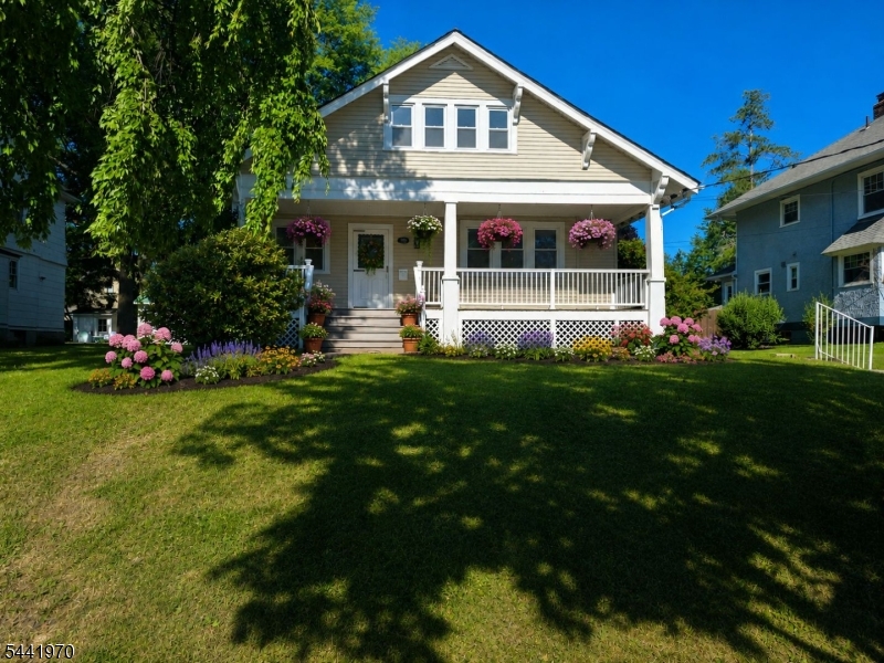 Welcome to 978 Kenyon Ave, Plainfield!  Nestled in the sought-after Cedarbrook Section, this beautifully updated Craftsman inspired Colonial 4-bedroom, 2.5-bath home blends classic charm with modern updates. Features include a classic full-width covered open front porch, wood burning fireplace, new windows, new roof, new boiler, new vinyl siding, and new appliances offering peace of mind and move-in ready appeal.  Spacious and functional layout include a first-floor bedroom with a full bath, ideal for guests or flexible living arrangements. The fully finished basement provides additional living space perfect for a family room, recreation area, home office, gym, or entertaining. Outside, enjoy a private yard, spacious deck for outdoor entertaining, and a 2-car garage, making this home ideal for both relaxation and gatherings.  Conveniently located near NYC train stations, bus lines, major highways, parks, shopping, schools, and houses of worship.  This home offers both accessibility, lifestyle and a wonderful opportunity to own a beautifully updated home in one of Plainfield's most desirable neighborhoods.  Don't miss it!