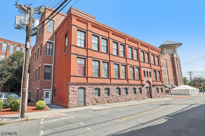 Welcome to this beautiful, spacious,open, condo. Located in the completely restored historical Mills Cooke complex. Located in the Great Falls Historical District of Paterson. This condo boasts open floor plan, kitchen features granite counter tops, stainless steel appliances. Offers marble tile. All this in an elevator building.This unit comes with 1 garaged parking spot. Also enjoy roof top lounging