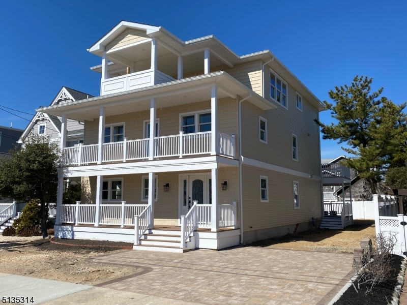 Beautiful COMPLETELY RENOVATED home steps away from the beach with plenty of ocean and bay views! 6 bedrooms and 5 baths in total. Custom Reverse Living with ELEVATOR access to all 3 floors. OPTION to create a Master Suite on second floor which would include Master bath/shower and 13x18 FT WALK-IN CLOSET! Large Front Porch and Back Deck, 2 Front Balconies and 1 Rear Balcony. PANORAMIC Ocean/Bay Views on 3rd Floor Balcony! Huge Kitchen and Living Area on 3rd Floor with Ocean Views all throughout. Kitchen includes Granite Tops, Center Island with oversized seating area, 9-FT WIDE PANTRY, Custom Tiled Backsplash, Under Cabinet Lighting, 6 Burner Stove, Convection Oven, Microwave in Center Island, Refrigerator, Dishwasher, and a Exhaust Hood Direct Vent to outside. Tankless Continuous Hot Water Heater, 3-Zone/2-Unit Heat & Air. Recessed Lighting, Custom Tiled Bathrooms and Hardwood Flooring throughout home. Granite topped wet bar leading directly to back deck. Enjoy the ideal location of this home including the private beach access of Seaside Park, while being only minutes away from the festivities of the Seaside Heights boardwalk!