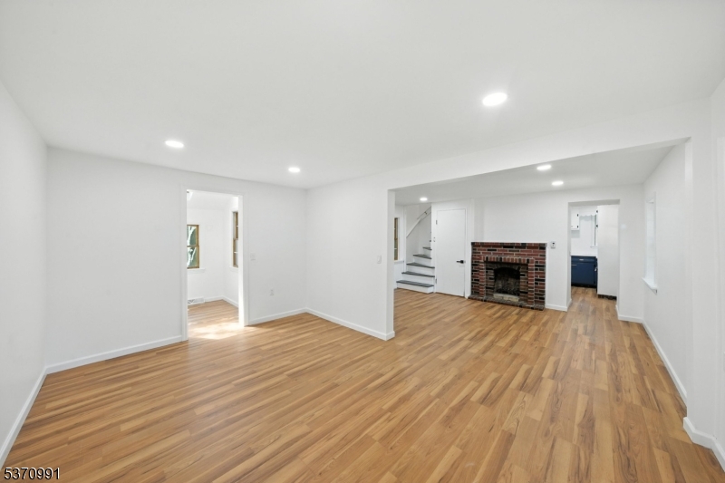 Welcome to this stylishly updated 3-bed, 3-bath home in the heart of Bloomsbury, NJ. From recessed lighting throughout to a cozy brick fireplace, this home blends classic charm with modern upgrades. The kitchen pops with bold cabinetry, stainless steel appliances, and clean lines. A private downstairs bedroom features a full bath and its own sauna, perfect for relaxation. Upstairs, two additional bedrooms, one of which has a private bathroom, and access to a deck. Enjoy outdoor living with a back deck, front patio, and a nice-sized yard. A BRAND-NEW SEPTIC SYSTEM, gas generator, 1-car detached garage, and basement laundry complete the package. All this, just minutes from local parks, trails, and top-rated schools. A rare find in a quiet town move right in!