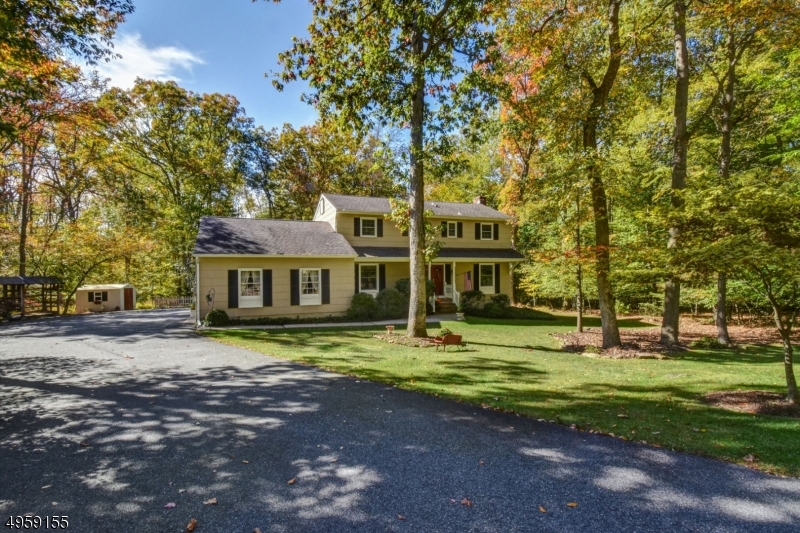 Well-kept Colonial in the desirable Ironia section. Features a renovated kitchen with plenty of room to entertain. Sprawling backyard with a beautiful deck and pool. Updated bathrooms with plenty of bedrooms on the second floor. Located on a quiet street.Note property has a Mendham mailing address.  4 Surrey Lane, Mendham NJ 07945