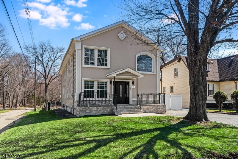 Spectacular in-town location steps from downtown Denville and NJ Transit train station!  Fully renovated home in 2022 with all the bells and whistles!  Two story entry wows you as soon as you open the door!  3581 sq feet of bright open floor plan where both entertaining and living is so easy!  Living area opens to dining and chef-worthy custom kitchen with custom white cabinetry.  Stunning huge custom contrasting breakfast bar/center island with quartz countertops, double ovens, beverage refrigerator, Viking and Thermador stainless appliances and glass tile backsplash.  Modern electric fireplace surrounded by a mosaic backdrop, cathedral ceilings, LED lighting, hardwood floors, huge pantry.  First floor office with glass door and private en-suite bedroom overlooking private yard and patio. Second level offers luxurious primary suite with soaking tub and oversized shower.  Another en-suite, two additional bedrooms and a hall full bath await..  Access to two lower level areas. Outside gives storage and access inside lends a rec room and utilities. Fenced yard with paver patio, stucco facade. Ideally located within easy walking distance of the train station on a quiet dead end street, this desirable corner lot home offers a safe, traffic-free environment, abundant natural light, expanded outdoor space, and quick access to the I-80 highway, shopping, and amenities, perfect for commuters and city getaways. It's a home run!  Inground pool needs work and will convey "as is"