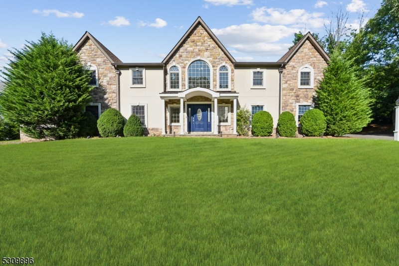 Impressive 6 bedroom, 5.1 bath Custom Colonial located in the highly sought-after Deerfield section of Short Hills. The first floor features grand two story entry foyer and great room with floor to ceiling windows, new custom kitchen (2021), spacious formal dining room with fireplace,  private office, and in-law suite with separate entrance. Second floor features expansive primary suite with sitting room, walk-in closet, full bath and four additional bedrooms and 2 full baths. Basement includes recreation/exercise area, full bath and storage. New heated lap pool (2023) with fountain and paver patio, new roof, smart sprinkler system, and AC/heating system.