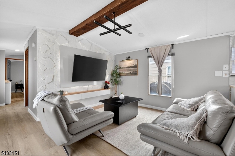 Welcome home to unit #B29 at Bayonne's Sunset Bay! This fully renovated 2-bedroom, 1-bathroom manufactured home is exactly what you're looking for. Inside you'll find modern updated flooring, an open-concept layout, in-unit laundry, as well as being freshly painted throughout. In addition, the home is equipped with a newer roof. Outside, you have your own private yard and can also enjoy a peaceful community with waterfront walkways, gazebos, and playgrounds, perfect for morning strolls or sunset views. With designated parking right outside your door this home blends comfort and convenience in one of Bayonne's best-kept secrets. Situated just minutes from local shops, restaurants, and easy access to NYC transit, this waterfront gem offers an unbeatable combination of location, lifestyle, and value. Whether you're downsizing or looking for a peaceful retreat near the city, this is the one! Schedule your showing of #B29 today!