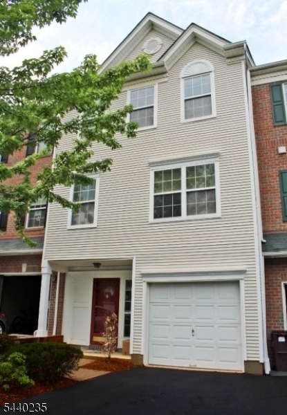 Welcome to this beautiful Hamilton Woods townhouse offering three levels of comfortable living space. The first floor features newer hardwood flooring, fresh paint, and a spacious bonus room ideal for a recreation area, home gym, or additional living space.The second level boasts a sun-filled family room with soaring ceilings and abundant natural light. A striking two-sided fireplace elegantly connects the formal living room and dining room, creating a warm and inviting atmosphere for both everyday living and entertaining. The den provides the perfect space for a home office or study.The spacious primary suite includes a large walk-in closet and ample room for relaxation. The entire home has been freshly painted and is move-in ready.Residents enjoy outstanding community amenities, including a clubhouse, swimming pool, tennis courts, exercise room, and playground. Located in highly desirable Basking Ridge, this home is part of one of New Jersey?s top-rated school districts and offers an exceptional lifestyle in a premier community.