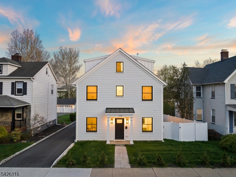Expertly designed by architect Tim Klesse, this stunning 2025 new construction offers sophisticated living space across four finished levels in the heart of Millburn. The residence showcases impeccable craftsmanship, from the gourmet chef's kitchen equipped with a quartz waterfall island and professional-grade Thermador appliances to the sun-drenched open-concept living areas that flow seamlessly to a charming side garden and a spacious, sun-filled backyard. This flexible floor plan features five bedrooms, including a versatile first-floor suite with a full bath that can serve as a private office or be easily converted into an additional living area. True luxury meets privacy on the upper levels, where each bedroom features its own dedicated en-suite bathroom, highlighted by a lavish primary retreat with a spa-like soaking tub and expansive walk-in closet. Complete with a finished third-floor guest suite and a spacious lower-level recreation room, the home is built to the highest standards with Andersen 400 windows, enhanced soundproofing, insulation and a pre-installed EV charging outlet, easy access from top-rated schools, Taylor Park, downtown, shops and the NYC Direct train.