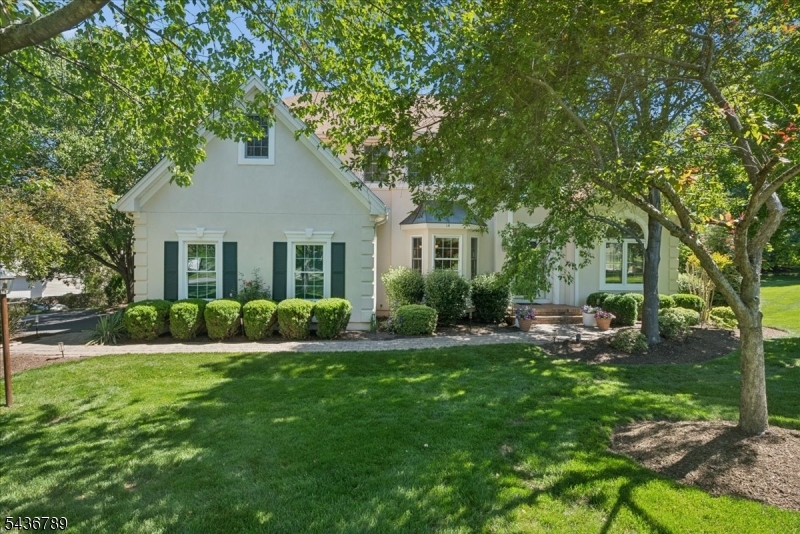 Positioned on a generous corner lot at the entrance to a quiet Cherry Valley cul-de-sac, this beautifully updated 4 bed/2.5 bath home offers the lifestyle that has made the community one of Montgomery Twp's most sought-after addresses. A dramatic two-story foyer welcomes you into interiors filled with natural light, soaring ceilings, and hardwood floors. The formal living room and family room are connected by a striking double-sided fireplace, while the family room flows seamlessly into the updated kitchen featuring white cabinetry, open shelving, a white tile backsplash, granite countertops, a center island, and premium Viking, Wolf, Sub-Zero, Miele, and Bosch appliances. The breakfast area opens to an expansive multi-level patio overlooking the backyard. A private first-floor office provides flexibility for work or study. Upstairs, the primary suite offers two closets and a spa-like bath with a freestanding soaking tub, dual vanities, heated towel warmer, and oversized glass-enclosed shower. Three additional bedrooms share an updated hall bath. The freshly painted basement offers abundant storage and future finishing potential, with exterior Bilco door access. Recent improvements include a new roof and a dedicated second-floor HVAC zone. Residents enjoy the option to join Cherry Valley Country Club for golf, tennis, swimming, dining, and an active social calendar. Just minutes from downtown Princeton and located within the award-winning Montgomery Twp School District.