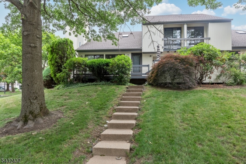 FULLY FURNISHED 2BR, 3.5BA townhome in the highly sought Cedars development in Basking Ridge available for rent! Enjoy peaceful living with natural views and cathedral ceilings with skylights inviting an abundance of natural light to fill the space. The interior features an updated eat-in kitchen with custom cabinetry including a wine rack, stainless steel appliances, and sliders that open onto the deck creating a seamless indoor-outdoor dining experience. A formal dining room leads to the living room, which features a wood-burning fireplace and another set of sliders onto the deck. The first floor also includes a powder room, laundry, and garage entrance. The 2nd level features a spacious loft with skylights leading to the primary bedroom that includes a full bathroom, two closets, and balcony. The second bedroom has a full en-suite bathroom. The basement adds another FULL bathroom and extra living space with a variety of options for use. This townhome also includes a one-car garage and an outdoor storage closet with access from the deck. As a tenant, you'll also enjoy access to a range of community amenities, including an outdoor pool, playground, tennis courts, and basketball courts. This property is further enhanced by its proximity to top-ranked schools, as well as convenient transportation options, with easy access to I78, I-287, and NYC trains and buses.