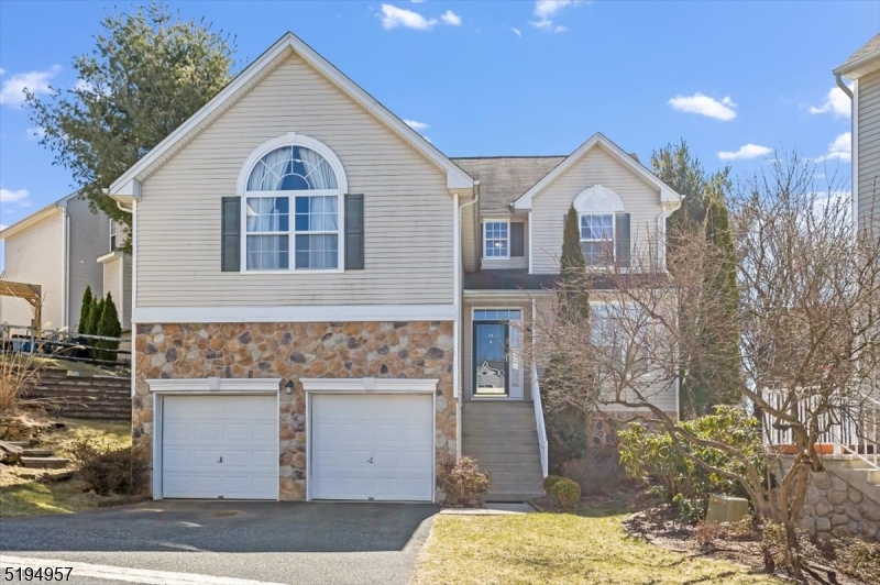 Welcome to this stunning 4-bedroom, 2.5-bath Elmwood model in Mount Olive, NJ's highly sought-after Woodfield community. This meticulously maintained colonial home boasts a spacious and elegant floor plan, perfect for modern living. The eat-in kitchen features updated stainless steel appliances with a separate eat-in nook, a Vaulted ceiling, a gas fireplace in the family room, and a formal dining room. The upstairs luxurious primary suite offers a vaulted ceiling, a walk-in closet, a spa-like en-suite bath with a soaking tub, and a separate shower. Three additional generously sized bedrooms share a well-appointed full bath. The finished basement provides extra living space, perfect for a home office, gym, or media room. Located in the highly rated Mount Olive school district, Woodfield offers fantastic amenities, including multi-use sports ct, playground, and walking trails. Conveniently close to major highways, shopping, and dining, this home is a must-see.