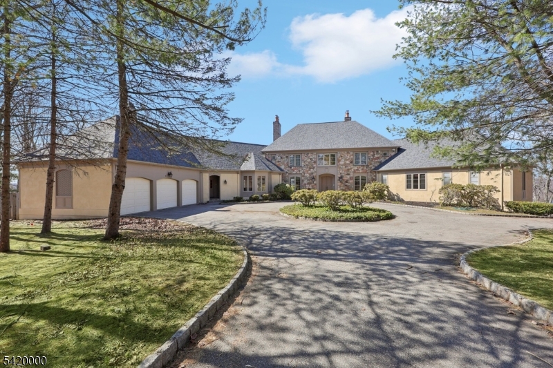 Welcome to luxury living in Smoke Rise, where this exceptional estate offers approximately 6,000 sq ft of refined living space w/magnificent views thru-out. Long private drive leads to a circular driveway & front entrance opens to a grand Foyer w/double guest closets. LR w/fpl, FDR w/sliders to a slate patio, expansive Great Rm w/fpl and additional patio access, perfect for seamless indoor-outdoor entertaining. Library w/marble fpl & Crawford ceilings adds timeless elegance. 1st flr Master Suite with walk-in closet and jetted tub, additional BR w/walk-in closet and fbth w/handicap-accessible shower. MEIK equipped w/center island, Corian countertops, pantry & sep din area, complemented by a Butler's pantry, Laundry Rm and 2 Powder Rms complete this level. 2nd flr offers BR w/fbth and oversized wlk-in closet, additional BR, Office, Art Studio, Sitting Rms, Bonus rms and another fbth. Huge Finished Bsmt expands the living space w/ a BR featuring a fpl and fbth, Rec Rm, Wine Cellar, Fitness area, additional fbth & 1/2 bth and an abundance of flexible living space. Additional highlights include walk-up attic, hardwood flrs under w/w carpeting, 2nd staircase, 3 car built-in Gar w/electric car charger and Sunroom leading to a private Backyard oasis with I/G pool. Enjoy resort-style living in the gated Smoke Rise community, offering 24 hr security, private 120-acre lake for swimming, boating & fishing, tennis, horseback riding, clubs, dining and year-round activities.