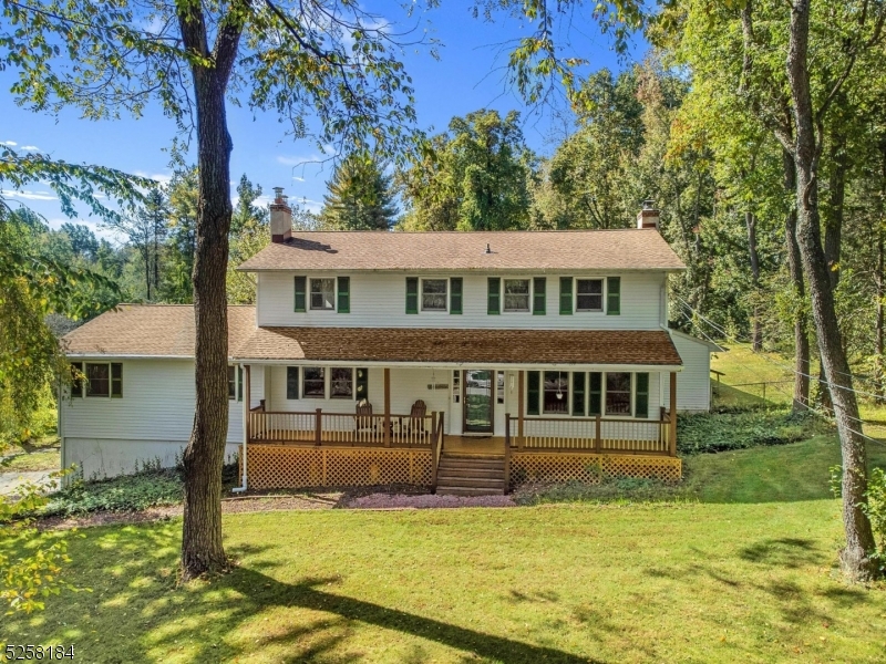 Covered rocking chair front porch greets you and leads to a flexible floor plan colonial on a quiet cul de sac in Chester Twp.!  Features include 1000sf first floor primary or In-law suite with outside entrance, full bath, living room with woodburning stove, sliders to deck, kitchenette, full bath, closets and more.  Main living area includes family room with TV and pool table (included), eat-in kitchen with wall oven, cooktop stove, breakfast area and bay window, formal living and dining rooms, sunroom, powder room and first floor laundry.  2nd floor includes 3 bedrooms, main bath plus primary suite with full bath.  Other features include 2 car garage, large unfinished basement, 9 year old owned 10KW solar array, fireplace insert and new chimney liner in living room, new central air system, above ground oil tank, 5 year old boiler, fenced garden area, deck and Boiler Mate on boiler.  Minutes to quaint downtown Chester shopping and dining, Chester schools, West Morris Mendham High School with IB Program and easy access to Rts. 80, 78, 24 and 10.  Ten minutes to Gladstone NJ Transit Train. Septic recently inspected with clean bill of health!
