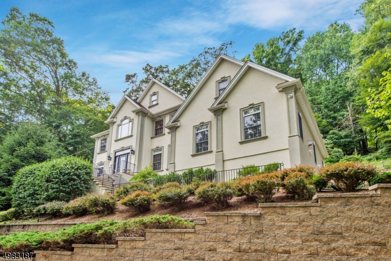 A private retreat just a mile from the heart of downtown Morristown! This 4 bedroom, 3.5 bath colonial with a truly oversized 3 car finished garage, is majestic! Tree top views. A grand 2 story entrance. An absolutely warm and welcoming open floor plan. 2 fireplaces, a massive family room and an expansive kitchen, top off the main floor! The 2nd floor includes 4 bedrooms. Highlighted by a gorgeous master bedroom w/incredible en-suite bath, ALL bedrooms have walk-in closets. Outside, you'll enjoy an extremely private sanctuary for gatherings and guests. A paver patio overlooking a beautiful private landscape! The basement is also just waiting to provide more entertainment. With too many Details to list, this home is a MUST SEE. Immaculate and MOVE-IN ready!
