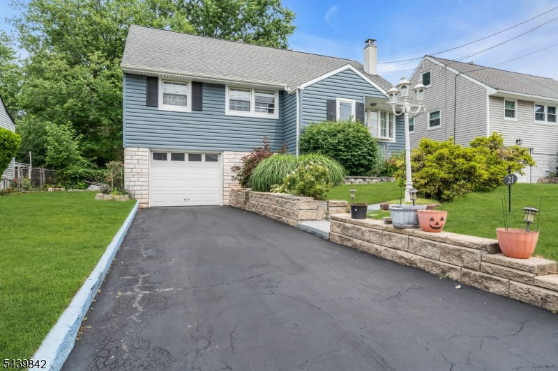 Beautifully maintained Cape Cod/Split-Level offering the perfect blend of charm, comfort, and thoughtful updates! This move-in ready home features newly refinished hardwood floors, a spacious living room with a stone fireplace, and an updated kitchen with white cabinetry, subway tile backsplash, stainless steel appliances, and generous counter space. The finished basement, renovated in 2018, provides additional living space, laundry, and storage, while the upper level offers 3 bedrooms, living/dining room. Second level provides 4th bedroom as well as very large attic space. Major improvements include a new sewer line (2018), roof (2017),  and multiple mini-split A/C units (2022). Enjoy your own private backyard retreat with mature shade trees, professional landscaping, covered porch, expansive paver patio, fenced yard, attached garage, and paved driveway. You will love the plethora of perenial flowers and bushes that the owner has put many years in to building and curating. Conveniently located just minutes from Menlo Park Mall, NJ Transit, Metropark, major highways, shopping, restaurants, parks, and schools, this home combines classic character with modern updates in an outstanding commuter location. Don't miss this exceptional opportunity!