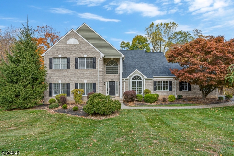 Experience refined living in this exquisite 5-bedroom, 3-bath Colonial ideally situated on the desirable southwestern side of Warren Township. Designed for comfort and style, this residence offers elegant living spaces and thoughtful updates throughout. A gracious foyer opens to a versatile first-floor room perfect for a guest suite, home office, or playroom. The gourmet kitchen is a true showpiece, featuring sleek modern design, higher-end appliances, and impeccable attention to detail. The home's interiors create an inviting ambiance, while the primary en suite exudes luxury with a full sitting room, plush carpeting, four custom closets designed for effortless organization, and bath with Jacuzzi tub and shower. The partially finished lower level provides soaring ceilings and abundant space ideal for a gym, studio, or private office. Recent upgrades include new high-efficiency air conditioning units and a hot water heater, ensuring comfort and efficiency throughout the seasons. Step outside to the crown jewel of this property: an impressive nearly 1,000 sq. ft. deck extending the full width of the home. Overlooking a serene wooded backdrop, this exceptional outdoor retreat offers the perfect setting for entertaining or simply enjoying the tranquility of nature. Additional features include a lawn irrigation system and invisible dog fence. New Roof! Located close to The Pingry School, in an excellent school district, and within close proximity to parks and all major highways.