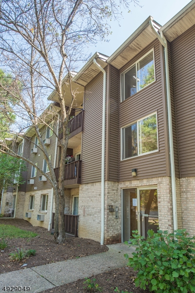 Located at the end of a private cul-de-sac, this fully updated & renovated end unit is in immaculate condition. This spacious 2 bed, 2 bath condo has new hardwood floors, moldings & new carpets in the bedrooms. The newly renovated open concept kitchen boasts updated cabinets as well as granite counter tops & high end appliances as well as upgraded ceramic tiles.  The spacious dining Room and Living Rm provides access to the balcony from which you can enjoy the open garden views. The large Master Bedroom, with walk-in closet leads to the master bath with wonderful counters and a large walk-in shower.  The second bedroom features a large closet with tons of light. Full size laundry in unit. Convenient to NYC transportation,shopping,restaurants, parks & major highways. 1 assigned parking & plenty guest parking.