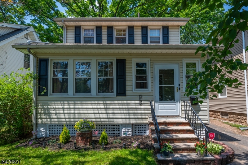 Beautifully maintained side hall colonial w/enclosed front porch/entrance vestibule perfect for sitting, relaxing and watching the world go by.  Sparkling Kit w/granite countertops, porcelain flooring, ss/black appliances, Bath w/ jetted tub & marble flooring. New shutters, new storm door, lovely patio under shade of magnificent, reputed 275 year old tree.  Located on wide, tree-lined street with a level lot & oversized detached garage with lots of storage & plenty of off street parking close to Rahway's great amenities including restaurants & train station w/ service to Newark Penn, Secaucus & New York's Penn Station & Long Branch in the other direction. Newark Liberty International Airport is just 9 miles away, along w/comprehensive network of major roads - Garden State Parkway, NJ Turnpike, I 287, I 78, Route 22 etc. Move-in ready!