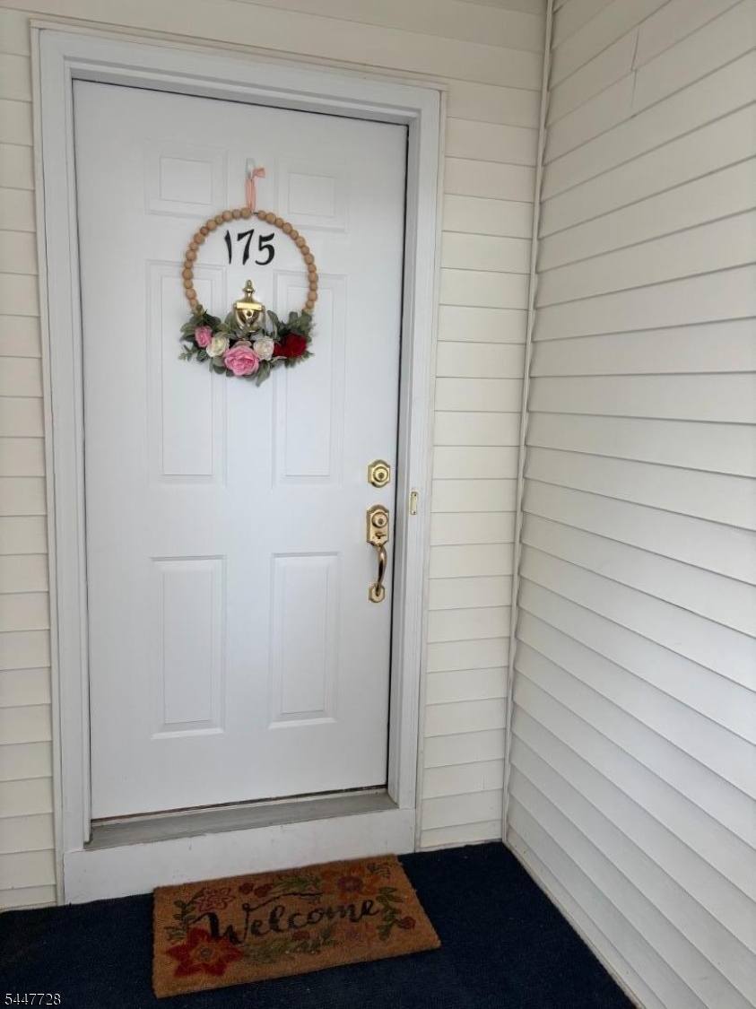 SHOWS LIKE A MODEL!  Beautifully maintained and updated first floor end unit.  Freshly painted interior (2020) in a neutral color palette. Laminate flooring throughout (2019). Bright kitchen w/2 windows overlooking a private yard.  Recent SS appliances (2023)  ,subway tiled backsplash (2019) & granite counter. Convienient stackable w/d.  Ceramic bath updated in 2020 (vanity, etc).  Contemporary light fixtures - all with dimmer switches (2020). Wood burning FP in LR (being conveyed "as is" w/no known issues - never used by Seller).  Glass sliding doors fill the LR with natural light and open to a private deck.  Great location allows private views from all windows! Large, dedicated storage room in basement. One car garage w/opener.Welcome to Spring Ridge - a beautiful residential community offering community pool, clubhouse, playground, tennis courts and walking/biking paths.