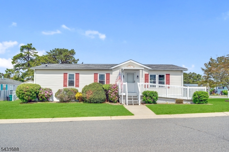 Beautifully situated on a desirable oversized corner lot just steps from the clubhouse and pool in Pine Ridge South Active 55+ Community, this handicap-accessible 2-bedroom, 2-bath ranch offers comfortable one-level living with a bright open-concept layout. Freshly painted throughout, the home features a brand-new kitchen complete with stainless steel appliances, white shaker cabinetry, and elegant quartz countertops. The newer roof, windows, vinyl flooring, HVAC system, and an energy-efficient instant hot water heater provides both comfort and peace of mind. The spacious primary suite offers a large closet and an ADA-accessible en-suite bath with a roll-in stall shower, while the second full bath includes a convenient tub/shower combination. the laundry room has a washer and dryer, utility sink, and additional storage, with direct access to the backyard. Outdoor features include a welcoming front porch with a handicap-accessible entrance, a nice backyard, and a large storage shed for added convenience. Residents enjoy a vibrant, active lifestyle with outstanding community amenities including a clubhouse with billiards, fitness center, library, card room, and meeting space, as well as bocce and shuffleboard courts, picnic areas, a heated swimming pool, and a full calendar of organized social activities. Monthly fees include property taxes for simplified ownership. Move-in Ready and ideally located-Schedule your Private Showing Today!