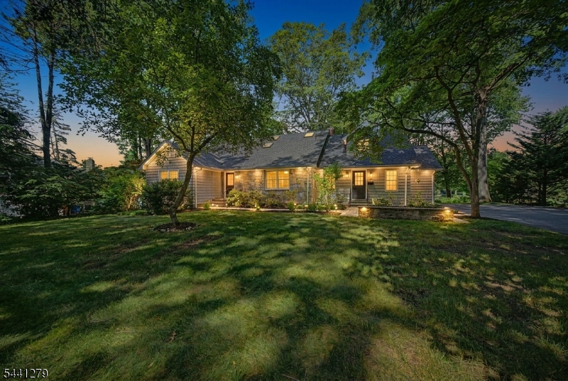A once-in-a-generation opportunity to own a premier lakefront property in Mountain Lakes! Offered for the first time, this exceptional Cape Cod is perfectly positioned on Wildwood Lake, just a short stroll from all three top-rated schools. This 4-bedroom, 3.5-bath residence showcases breathtaking waterfront views and offers an extraordinary lifestyle where every day feels like a retreat. Wake to the serenity of the lake, enjoy coffee overlooking the water, and embrace year-round recreation with kayaking, paddleboarding, fishing, and endless opportunities to entertain! Rich in character and ready for its next chapter, the home features a spacious living room, an open-concept kitchen, a screened-in porch, a versatile floor plan, and beautiful water views throughout. Set on an impressive 0.86-acre property, the expansive grounds offer exceptional privacy, a generous front lawn, and abundant space for outdoor entertaining or future expansion. Additional highlights include a two-car garage, a new roof, a new water heater, fresh interior paint, and a whole-house gas generator providing peace of mind while offering the opportunity to personalize this timeless residence to your own style. Located near parks, shopping, dining, recreation, and convenient transportation to New York City, this is a rare opportunity to own one of the area's most coveted waterfront properties and experience the unparalleled lifestyle that makes Mountain Lakes one of New Jersey's most desirable towns!