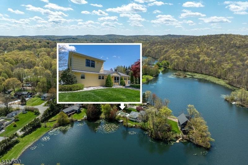 Peninsula Haven - Welcome to lakefront living in Barry Lakes, a private Vernon Township lake community surrounded by natural beauty and year-round recreation. Set on a low-traffic cul-de-sac peninsula with 228 feet of lake frontage, this TRUE 5-bedroom, 2-bath home offers privacy, expansive water views, an inground pool, and two docks for easy lake access.A fenced front yard with mature privacy hedges leads to a covered entry and welcoming foyer. Inside, the living room centers around a charming brick fireplace before flowing into the dining area and kitchen. Toward the rear of the home, a bright vaulted sunroom wrapped in warm wood walls, skylights, and walls of windows captures sweeping 180-degree lake views and opens directly to the newer deck and pool area an ideal setting for quiet mornings, summer gatherings, and sunset evenings by the water. The main level includes three bedrooms, a full bath, mudroom, and an additional full bathroom, while the upper level offers two generous bedrooms with vaulted ceilings. Outside, enjoy off-street parking, a pool shed, lakefront lawn space, and the peaceful feel of a true retreat. Recent updates include a newer roof, 2021 deck, water heater replaced in May 2025, and septic inspected and serviced in 2026. Barry Lakes offers lakes, beaches, clubhouse, playground, ball field, basketball court, and community-maintained roads, with Wawayanda State Park, the Appalachian Trail, Crystal Springs Resort, and Warwick, NY nearby.