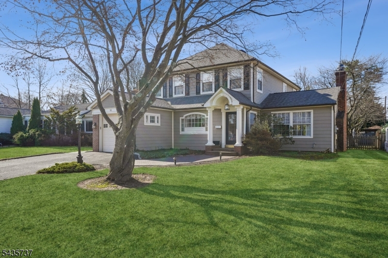 Welcome to this stunning 4-bedroom, 2.5-bath Custom Colonial offering the perfect blend of elegance, comfort, and functionality. The first floor features a spacious open-concept layout highlighted by beautiful hardwood floors throughout. Upon entering, you are greeted by a foyer that sets the tone for the home, with a charming sitting room just off the entrance. The living room serves as the centerpiece of the home, featuring a beautiful fireplace and abundant natural light. A sunroom/family room provides additional living and gathering space, flowing seamlessly into the dining room. The dining area opens to a chef's kitchen complete with stainless steel appliances, stone countertops, and ample cabinetry, making it ideal for both everyday living and entertaining. A stylish powder room and convenient first-floor laundry room complete the main level. Upstairs, the second floor offers four generously sized bedrooms, including a remarkable two-story primary suite featuring its own private ensuite bath and loft. A large hall bathroom serves the additional bedrooms. The partially finished basement offers flexible space perfect for a recreation room, office, or playroom, along with a separate utility and storage area. Outside, enjoy a fenced backyard designed for entertaining and relaxation. Direct access from the dining room to the deck creates a seamless indoor-outdoor flow, making it the perfect setting for gatherings, outdoor dining, and enjoying the private backyard.