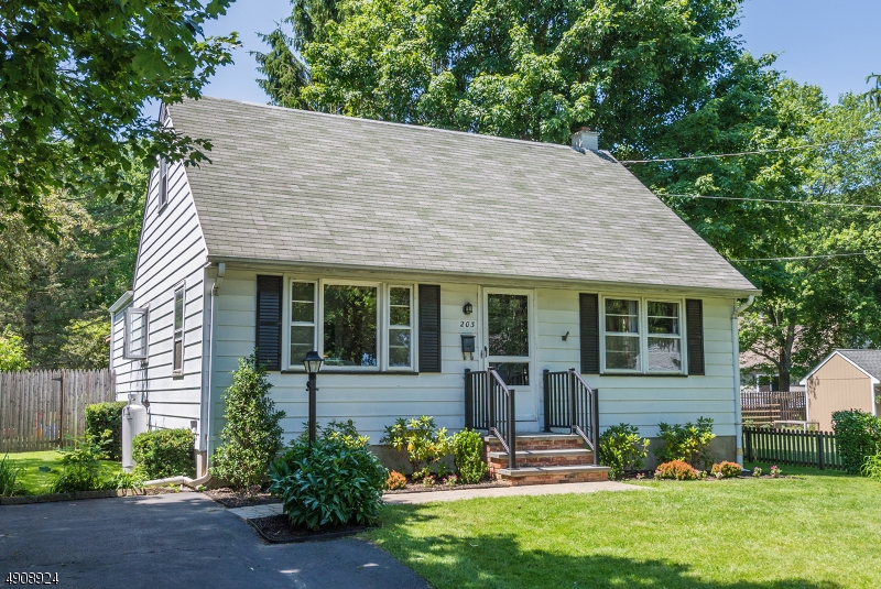 Great place to start, upsize or downsize!  Fantastic location, minutes to everything Hackettstown has to offer.  Screened porch and deck overlook level, private, fenced backyard with storage shed. Step inside and be surprised by the amount of space!  Wood floors, spacious rooms, family room/den/play room has vaulted ceiling, partially finished basement, washer/dryer/fridge included.  Gas line at the house for easy conversion, seller offers a home warranty and $2500 credit towards new windows.  Nothing else to do!