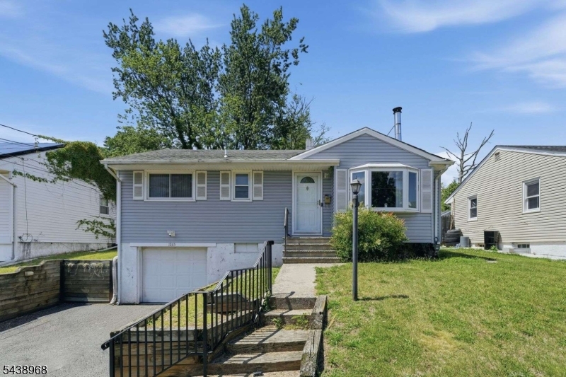 Welcome to this well-maintained ranch-style single-family home in Plainfield City! This home offers comfortable one-level living with the added flexibility of an unfinished basement, ready for storage, a workshop, or future finishing to suit your needs.The kitchen features a convenient breakfast bar, creating a functional space for meal prep and casual dining. A freestanding wood stove fireplace adds warmth and character to the living area, making it a cozy place to gather throughout the seasons.Additional highlights include an attached one-car garage and a driveway with two-car width, blacktop and hard-surface construction, plus exterior lighting for added convenience.Don't miss the opportunity to explore everything this property has to offer. Schedule your private showing today!