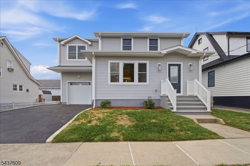 Completely renovated custom colonial with 4 beds, 2 1/2 baths. Large addition put on totaling over 2500sqft. 1st floor features an open concept with large eat in kitchen, custom cabinets, center island with quartz counters, high end appliances including wine fridge, living room, dining room, family room and powder room complete this floor. 2nd floor features a primary bedroom with walk in closet and a full luxurious bathroom.  3 additional bedrooms, full bathroom and laundry complete this floor. Full finished basement perfect for recreation room or additional living space. Large yard with privacy fence. Additional amenities include oversized garage with high ceilings, new roof, new Anderson windows, new multizone central air/ heating, new plumbing, new electrical, hardwood floors, crown molding. Conveniently located near restaurants, shops, schools, major highways and NYC transportation. Nothing to do here and a must see!