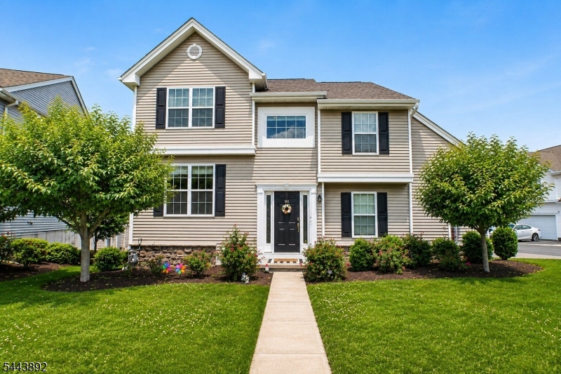 MINT! Welcome To Easy, Maintenance-Free Living In The Highly Desirable Woodfield Community! Built In 2021, This Beautifully Maintained Townhome Offers The Feel Of New Construction Without The Wait. Bright, Airy & Filled With Natural Light- Its Open-Concept Design Spans Three Finished Levels, Offering The Perfect Blend Of Comfort, Style, Functionality, & Flexibility. The Main Level Features Rich Hardwood Flooring Throughout, A Spacious Living Room With Fireplace, Formal Dining Room & A Gourmet Kitchen With Granite Countertops, Custom Cabinetry, SS Appliances With Designer Backsplash & A Large Center Island Overlooking The Living Area. A Convenient Powder Room & Direct Access To The Attached One-Car Garage Complete The Level. Upper Levels Feat. Three Generously Sized Bedrooms, Incl. A Spacious Primary Suite W/Tray Ceiling, Recessed Lighting, Two Closets Incl. A Walk-In & A Private Bath. A Second Full Bath & Second-Floor Laundry Add Everyday Convenience. A Rare Highlight Is The Exceptionally Deep Walk-Out Lower Level Offering A Finished Family Room W/ Sliding Glass Doors To A Private Patio, Plus An Oversized Unfinished Storage Area Rarely Found In Townhomes! BONUS! Enjoy Low-Maintenance Living With Exterior Maintenance, Lawn Care & Snow Removal Handled By The Association, Along With A Community Pool, Playgrounds, Sports Courts, Ball Fields & So Much More! Ideally Located Within The Highly Acclaimed Mount Olive School District Makes This One A True Winner.. A Must See!