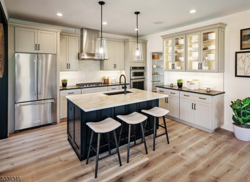 Welcome to Oaks at Randolph, Toll Brothers newest resort-style amenity community! The Anders airy foyer is open into the impressive great room and charming casual dining area with rear yard access. The well-designed kitchen is enhanced by a center island with breakfast bar, ample counter and cabinet space, and a sizable walk-in pantry. The splendid primary bedroom suite is highlighted by a spacious walk-in closet and an alluring primary bath with a dual-sink vanity, a luxe shower, and a private water closet. Secondary bedrooms, one with a walk-in closet and the other with a sizable closet, share a hall bath. Additional highlights include a generous loft ideal for a work from home space, conveniently located second-floor laundry, a powder room off the foyer, and additional storage throughout.
