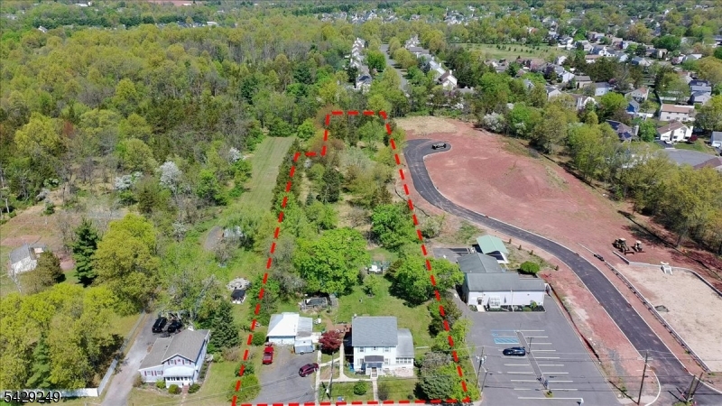 Rare opportunity to own a 2.5-acre property in desirable Hillsborough Township featuring a mother-and-daughter home and a detached two-car garage, with future development potential. The existing home is situated on a generous parcel that may allow the home to remain on approximately 1 acre, with the opportunity to build a new home on the remaining 1.5 acres, subject to all township approvals.The rear parcel may offer future access from Zenk Court, one of the last public roads in the area, adding potential value and flexibility for residential development. All subdivision, zoning, variances, and access approvals are the sole responsibility of the buyer and must be verified independently with the Township of Hillsborough.Ideal for an end user seeking space and privacy, or for investors and builders exploring future possibilities. Conveniently located near major roadways, shopping, and schools.Property being sold as-is..