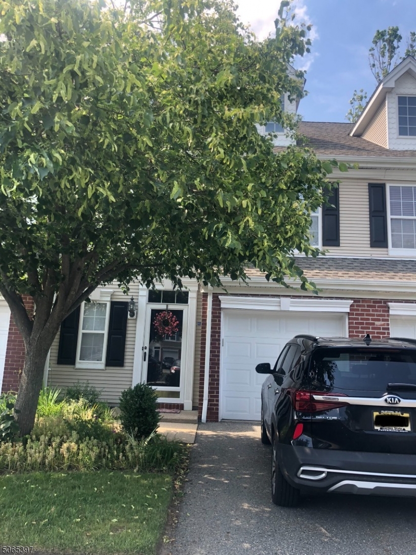 You are going to love this stylish town home featuring new wood floors in the entrance, living room and dining room and new kitchen with w stainless steel appliances and granite counters. Relax in the sunlit  living room with its vaulted ceiling, two story windows and gas fireplace. The neutral color is sure to please. This community  is only minutes to route 287, and the Towaco Town Center with shops, restaurants, the train to NYC and bus too.