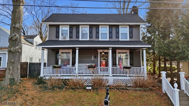 Nestled in the heart of Bloomsbury, this charming 1870 colonial blends historic character with modern updates and thoughtful improvements throughout. A deep rocking chair front porch spans the width of the home and sets a welcoming first impression. Inside, the layout offers three comfortable bedrooms and one and one half bathrooms along with bright living and dining spaces featuring tall windows, classic millwork, and period charm. The kitchen is beautifully updated with crisp cabinetry, granite counters, stainless appliances, stylish tile backsplash, and an elegant tin style ceiling that adds texture and warmth. Large windows bring in generous natural light and provide a cheerful setting for daily meals or entertaining. Upstairs, the full bath is conveniently located near all bedrooms. Beyond the main home, a fantastic bonus studio space is attached to the garage that is currently used as a music and entertaining room, featuring vaulted ceilings and flexible square footage suited for creative hobbies, fitness, or future workspace needs. The property includes mature trees, established plantings, and yard space for gardening, pets, or outdoor enjoyment. The exterior showcases timeless curb appeal with neutral siding, decorative shutters, and a wide front porch that reflects the home's early heritage. With driveway parking, storage, and convenient access to commuter routes, river towns, shops, and recreation, this home offers historic charm with modern livability.