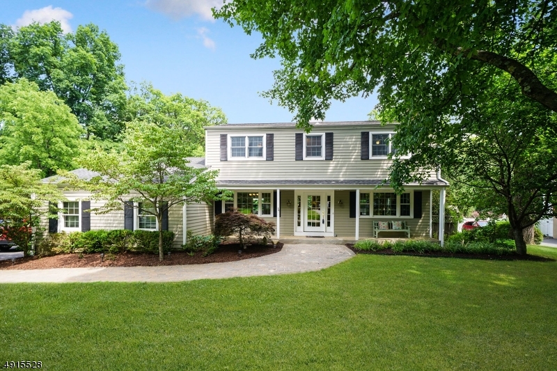 Absolutely fabulous CHC in quiet neighborhood that backs to Patriots Path!  Relax on your lemonade front porch!  This marvelous colonial offers a front to back LR with woodburning, brick fireplace, DR with architectural moldings, newer eat-in kitchen with granite countertops & stainless steel appliances open to family room & sliders to deck, family room with dry bar for entertaining, & powder room complete the first floor.  Second floor features a spacious master suite with private bath, 3 additional bedrooms & main bath.  Lower level offers a rec room, office area, storage & more.  Hardwood floors throughout! The fenced, level,backyard has an inground pool, a tree house, an adorable shed and lots of green space for any activity.  Your oasis is waiting for you.