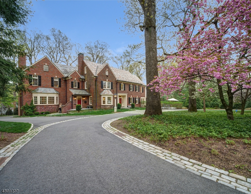 This stunning All Brick Colonial has 7 bedrooms and 4.1 stunning baths, ideally located on .94 of an acre of newly landscaped gorgeous property. Features a spectacular new massive kitchen/family room with fireplace, stone floors, state of the art appliances, & a huge great room addition, could be a wonderful guest suite, w/ vaulted ceiling, fireplace & wet bar! The luxurious master suite has a vaulted ceiling & fireplace, 2 massive walk-in closets & a spa-like master bath. 2nd level has 3 additional bedrooms that share 2 gorgeous full baths. 3 morel bedrooms share a full bath on 3rd level. Has new circular driveway, incredible 5 car heated garage, new windows, a huge sunny exercise room & heated walkways! Bus service available to Deerfield Elementary, Millburn Middle & High School!
