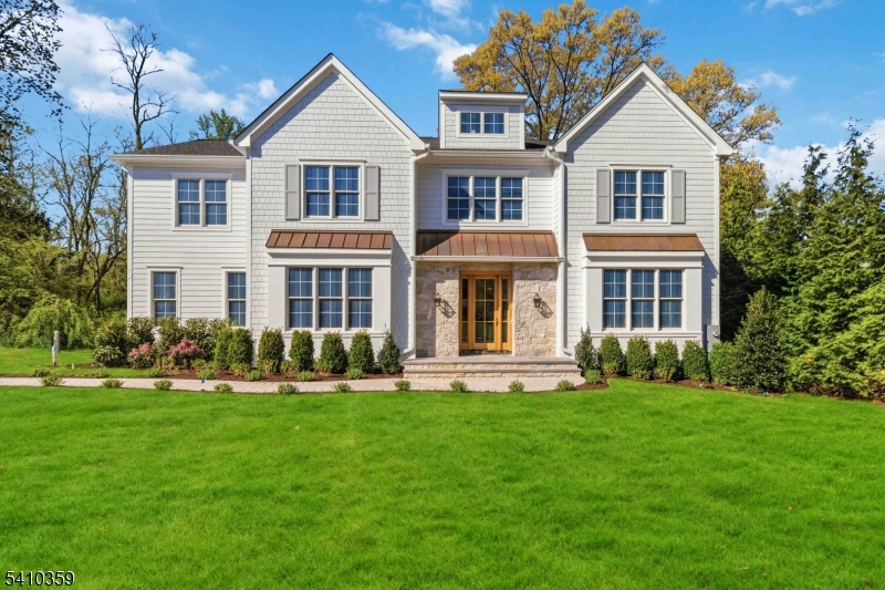 Exceptional New Construction by Clear Brook Properties. Poised on a serene .71-acre cul-de-sac, this architectural masterpiece spans over 7K sqft. of bespoke luxury. Beyond the striking copper roofing and flickering gas lanterns, discover an interior defined by 7" white oak engineered flooring and exquisite millwork. The heart of the home is a true gourmet's kitchen featuring a Wolf/Sub-Zero suite, an expansive center island, and a dual-pantry system (Walk-in + Butler's). It flows seamlessly into a family room anchored by an oak-coffered ceiling and beverage nook opening further to a massive with a full outdoor kitchen. Key Highlights: Primary Sanctuary - A massive retreat featuring three walk-in closets and a radiant-heated, spa-inspired bath. The Lower Level: An entertainer's dream with a custom Italian glass and climate-controlled wine cellar, professional gym, custom bar with quartzite countertops, custom built-ins for the entertainment area, and a flexible "Simulator Room" for golf or cinema. Modern Tech: Whole-house generator, EV charging station, and radiant heating in all baths, mudroom, and laundry. With 7 bedrooms and 6.5 baths, this custom home blends timeless quality with 2026's most sought-after amenities. This home is a must-see!