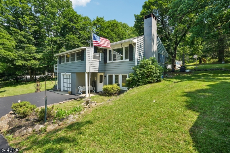 Welcome to 14 Bunnvale Road! Nestled on approximately 3 picturesque acres in the heart of scenic Hunterdon County, this beautifully maintained 3-bedroom, 2-bath home with spacious garage and storage shed offers the perfect blend of privacy, comfort, and country charm. Surrounded by peaceful views, the property provides a tranquil setting while remaining conveniently close to everyday amenities. Inside, you'll find a warm, open and inviting layout designed for comfortable living, with well-kept spaces that reflect pride of ownership. Step outside to enjoy the expansive grounds, ideal for gardening, recreation, or simply relaxing while taking in the charming countryside vistas. Located just minutes from the quaint downtown Main Street of Califon, you'll enjoy easy access to local shops, restaurants, and community events. Outdoor enthusiasts will appreciate the abundance of nearby recreational opportunities, including hiking, fishing, horseback riding, parks, and nature preserves that make Hunterdon County such a desirable place to call home. Whether you're looking for a peaceful retreat or a place to entertain, this exceptional property offers a rare opportunity to enjoy the beauty and lifestyle of country living without sacrificing convenience. 1st FLOOR HAS CLOSE TO 600 SQ FT NOT INCLUDED IN TOTAL SQUARE FOOTAGE (1st level walk in driveway level). LOW LOW TAXES!!! Welcome Home!!