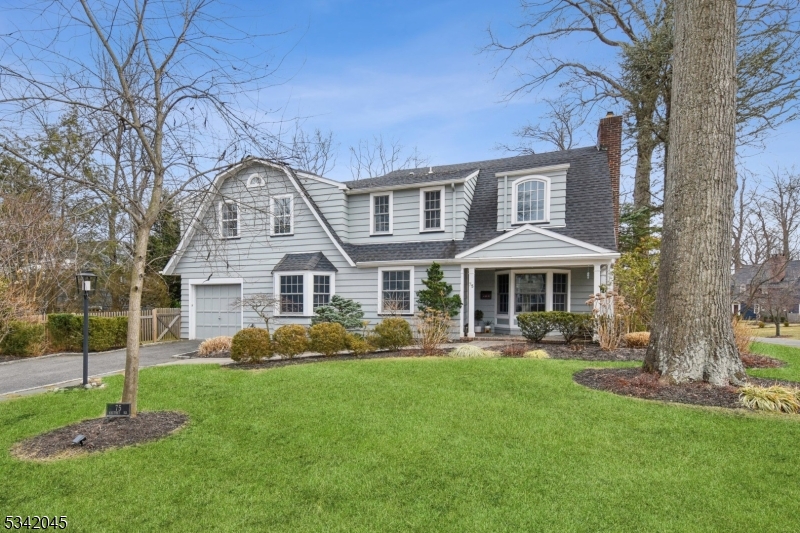 Stunning Short Hills Colonial in Prime Knollwood Location. A rare opportunity to own a fully renovated Colonial blending classic charm with modern sophistication in a sought-after neighborhood. Step into the spacious foyer and flow effortlessly into the elegant living room with a wood-burning fireplace, a sunlit dining room with a bay window, and a sleek Scavolini eat-in kitchen. Designed for both style and function, the kitchen features quartzite countertops, a large pantry, premium stainless steel appliances (Wolf, Sub-Zero, Miele), a center island with bar seating, and soaring ceilings with skylights. A mudroom leads to the inviting family room, perfect for gatherings. Upstairs, four spacious bedrooms and three pristine baths include a chic primary suite with an exposed brick wall, two walk-in closets, and a contemporary bath with a white double vanity and glass shower. The lower level offers a rec room, laundry room, and half bath. Outdoor spaces include a charming covered front porch and a bluestone patio overlooking the fenced yard ideal for entertaining. Additional highlights: newer windows, a 20kW built-in generator, Sonos-ready speakers, staircase millwork, underground sprinklers, and a two-car-wide driveway.Unbeatable Location! Walk to Millburn & Short Hills train stations (0.8 miles) for direct NYC access, Millburn Middle & High Schools, downtown shops, and restaurants.. A picture-perfect retreat with every modern amenity, this home is a must-see!