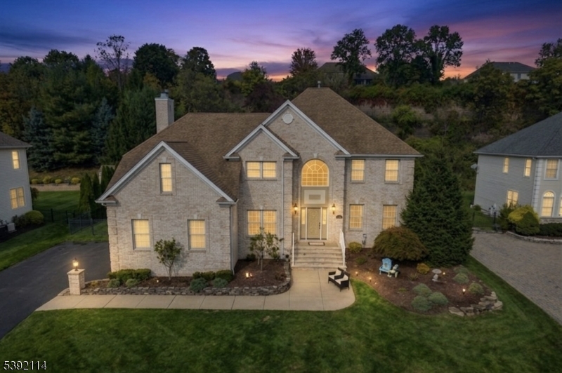 Welcome to this spacious and well-maintained 6-bedroom, 3.5-bath Center Hall Colonial nestled in the desirable Arlington Estates section of Totowa. This home offers an ideal layout with plenty of room for comfortable living and entertaining.The main level features a welcoming formal living room and dining room, a spacious family room with a cozy fireplace, and an updated eat-in kitchen with granite countertops and ample cabinetry. A first-floor bedroom provides great flexibility for guests or a home office.Upstairs, you'll find four generously sized bedrooms, including a primary suite with a private full bath and large walk in closet.The finished basement with private entrance offers an extended living suite complete with a kitchenette, living area, bedroom, and full bath.A private backyard, attached garage, and convenient location near schools, shopping, and major highways make this home an exceptional find in one of Totowa's most sought-after neighborhoods.