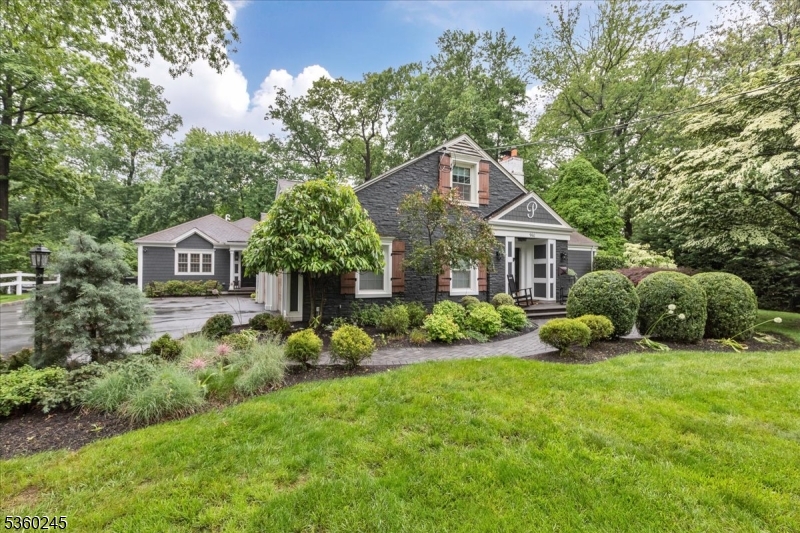A rare offering where exceptional design meets extraordinary flexibility, this stunning home, renovated in 2013 with a seamless 2017 addition, offers a one-of-a-kind residence with two distinct living spaces, each with its own entrance and full kitchen, seamlessly connected by an interior hallway. Ideal design for dual living, extended guests, private office space, or flexible living while maintaining the warmth of a single elegant home.The main residence features a dramatic living room with custom stone wood-burning fireplace and gourmet kitchen with massive teak island, Viking 6-burner cooktop, two Viking dishwashers, farmhouse sink, and paneled refrigerator. French doors from dining and family rooms open to a private courtyard. The first floor offers a bedroom suite with dual closets and luxurious bath with double vanity, soaking tub, and oversized shower, plus a private den with full bath, barn-door closets, and stackable washer/dryer. Upstairs, the primary suite features dual staircases, skylights, sitting area, custom walk-in closet with center island, and spa bath with soaking tub, dual shower, and private water closet. Finished basement, expansive unfinished storage, hardwood floors, recessed lighting, crown molding, and attached two-car garage.The 2017 addition offers soaring ceilings, gourmet eat-in kitchen, mudroom, laundry, private suite with radiant heated bath floors, walk-in closet, courtyard access, second bedroom, full bth. handicap acc. See flr plans.