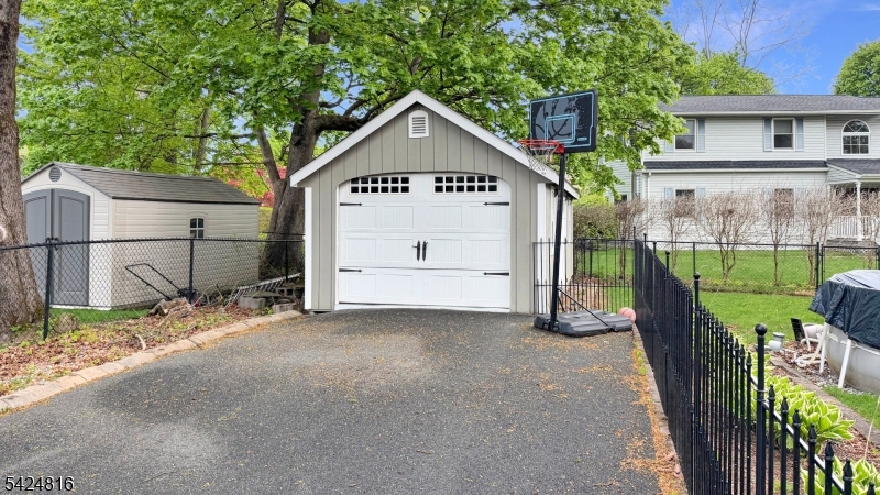Much larger than it appears! This beautifully maintained 4-bedroom Cape Cod sits on a spacious, level corner lot and is truly not your typical cape. The home features a flexible layout with one bedroom on the first floor and three generously sized bedrooms on the second floor. There is a full bathroom on each level for added convenience. Enjoy a large living room and an expansive kitchen, perfect for everyday living and entertaining. The fully fenced yard offers privacy and plenty of outdoor space, along with a detached one-car garage. A wonderful opportunity to own a charming, move-in-ready home with more space than meets the eye!
