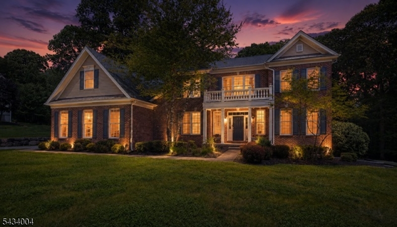 Spectacular 5-bedroom, 4-bath Toll Brothers brick-faced Colonial in prestigious Morris Hunt in Flanders offers approximately 4,926 SF of above-grade living space on 1.22 flat acres w/ elevator access to every level. A grand two-story foyer w/dramatic princess staircases, rich hardwood flooring, & elegant millwork creates an unforgettable first impression. The stunning floor-to-ceiling stone fireplace anchors the living room, while a striking third open staircase leads seamlessly into the chef's dream kitchen featuring custom wood cabinetry, granite center island, stainless steel appliances, recessed lighting, & abundant workspace. Formal living & DR showcase refined crown molding & timeless detail throughout. The sun-filled sunroom opens to a young Trex deck complete w/a pergola-covered hot tub & outdoor bar area, perfect for entertaining or relaxing in total privacy w/no neighbors across the street or behind the property. A first-floor bedroom & full bath provide an ideal guest or in-law suite. Upstairs, the luxurious primary suite features a sitting room, dual walk-in closets, & spa-like bath w/jetted tub, oversized shower, & double vanity. A princess suite w/private bath plus two additional bedrooms connected by a Jack & Jill bath complete the second level. The expansive walkout basement offers sheetrocked walls, freshly painted ceiling, extensive storage, & endless potential for recreation, gym, or additional living space. Full ADA-compliant accessibility throughout.