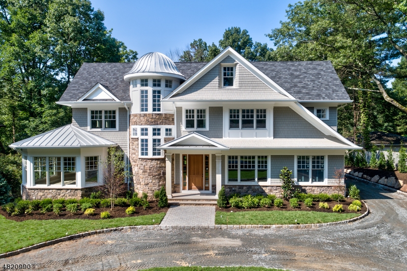 This is the one! Custom home in the heart of Short Hills w/expansive flat yard backing to woods, steps to NYC train, schools and town.No detail has been overlooked ,must be seen to fully appreciate. Herringbone wood floored foyer, leads to Living Room, formal Dining with Butler's Pantry access & central Kitchen, high-end appliances & oversized center island with breakfast bar access to flat yard and patio. massive Family Room with stunning gas fireplace!2nd level boasts luxurious Master Bedroom suite with sitting area, ensuite marble bath & dual walk-in closets. Finished 3rd level with full bedroom suite.Expansive Lower Level with Rec Room, Media Room, Exercise Room, Game room, potential wine cellar & ensuite guest room! Don't miss this rare opportunity to make this one of a kind, spectacular new home yours!