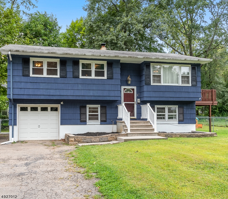 Welcome to this Oversized and Updated Bi-Level home in sought after Mt Olive! 4 Bedrooms, 2 Full Baths, Open Concept Living, Large Family Room, Fresh Neutral Paint throughout and Great Outdoor space! First floor offers Updated Kitchen w New Stainless Appliances and Open Concept to Dining and Living areas. French Door leads to Large Deck for convenient Barbecuing/Entertaining, 3 Bedrooms w New Carpet, Windows and the Main Bath complete the floor. The Lower Level Family Room is spacious w Sliders leading to Patio and Flat, Fenced Yard, 4th Large Bedroom/Office, Full Bath, Laundry Room and Garage Entrance. Natural Gas conversion underway w NEW Boiler, Newer Roof, Central Air, Public Sewer and Water Softener. Enjoy Great Schools, Public Parks, Convenient Shopping and Commuting. Move in Ready!!