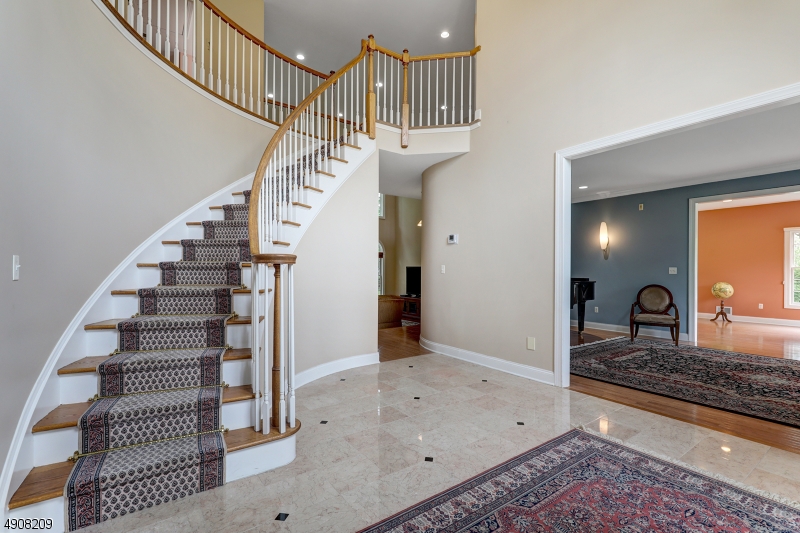 Impressive brick colonial located on a cul-de-sac on the east side of town offering tons of light, wonderful entertaining space, both indoors and out, and a first floor suite. The home is a stunning brick colonial with ample room for entertaining. There are tons of windows throughout the home, allowing light to stream in from all directions. The main floor offers a two story entry foyer, dining room with butler's pantry, living room, conservatory, two story family room, gourmet kitchen with granite countertops; Sub-Zero refrigerator; Viking gas cooktop; Thermador double ovens; center island and wet bar; ensuite bedroom, laundry room and powder room. Master suite with gas fireplace, 3 other bedooms and 3 full baths complete the 2nd floor. Perfect location - east side on a cul de sac.