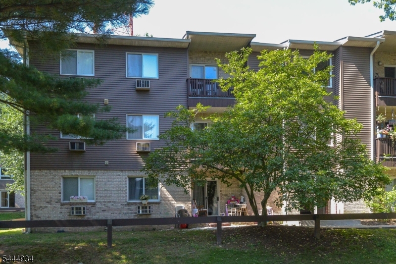 Welcome to this turnkey top-floor unit at Pompton Village Condominiums. Ideally situated in a quiet, private location, this condo offers a house-like feel with all the low-maintenance perks of condo living. Step out onto your private balcony to enjoy peaceful views of the surrounding greenery, the perfect spot for morning coffee or unwinding at the end of the day. Luxury vinyl plank flooring runs throughout the entire home, with decorative crown molding in the living and common areas. The remodeled kitchen comes fully equipped with a newer oven, over-the-range microwave, and refrigerator, complemented by a stylish tile backsplash. The spacious master suite offers a large walk-in closet and a spa-like en-suite bath with double vanity, walk-in shower, Delta rain shower head, and handheld sprayer. The hall bathroom was recently updated with a new tub, sliding glass shower door, decorative mosaic tile accent band, tiled niche, and modern Delta shower fixtures. This home has been thoughtfully updated for worry-free living, featuring a newer hot water heater, a water softener professionally installed by A1 Water Solutions, and a newer in-unit washer and dryer. Both bedroom closets have been custom built by Butler Closets and a full attic provides plenty of extra storage space. This move-in-ready home is ideal for commuters with a nearby bus to NYC and easy access to shopping, restaurants, parks, and major highways. Please note: Pompton Village Condominiums is not FHA approved.