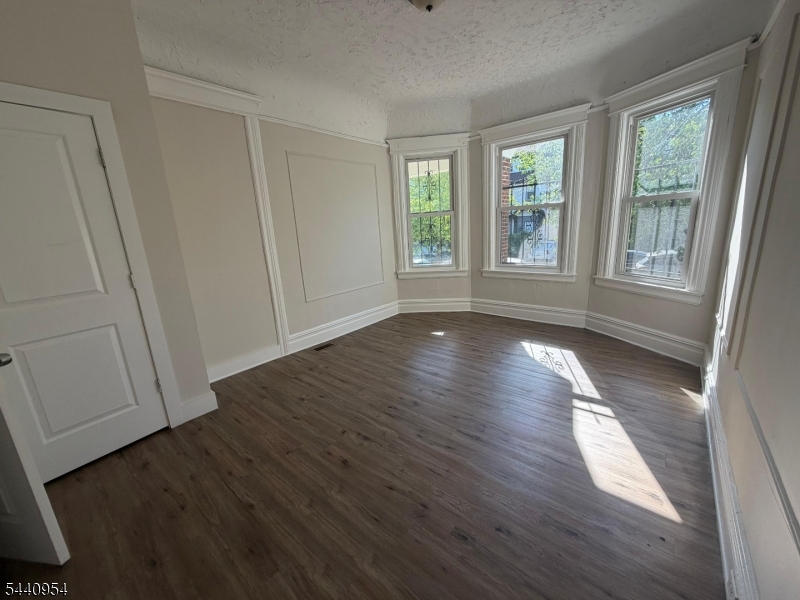 Spacious 3-bedroom, 1-bath first-floor apartment in Newark's Upper Clinton Hill section. 1,220 sq ft in a well-kept three-family building, close to NJIT, Rutgers-Newark, Seton Hall, Newark Beth Israel, and Newark Penn Station, with quick access to I-78 and Newark Liberty Airport.